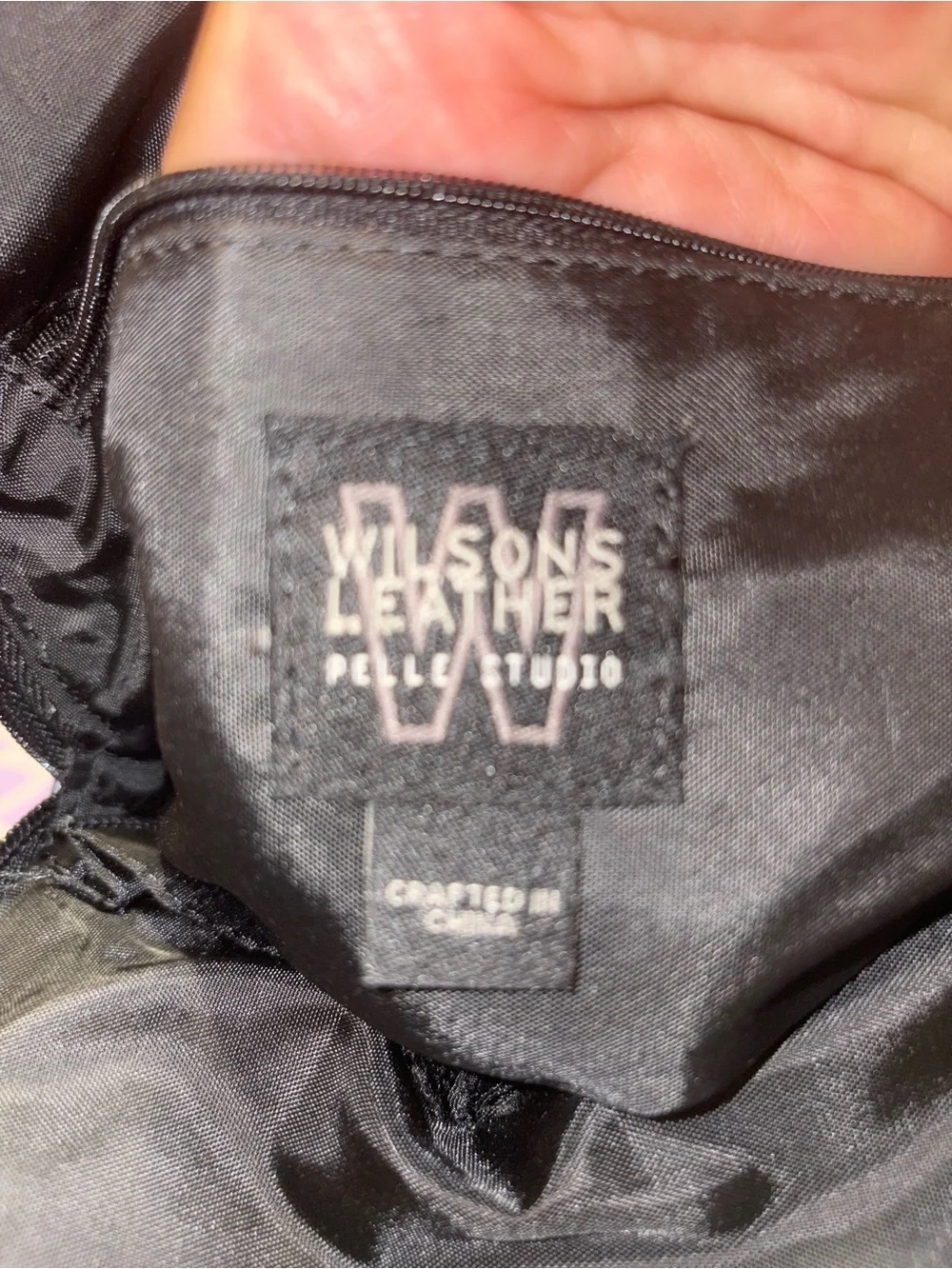 Pelle studios from Wilson leather back pack /organizer. Measures 9 by 9 by 3”
